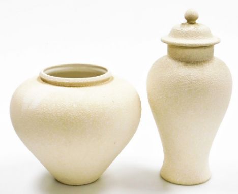 Two French studio pottery vases, each on a white ceramic ground, with applied mottled detailing, comprising jar and cover, 36