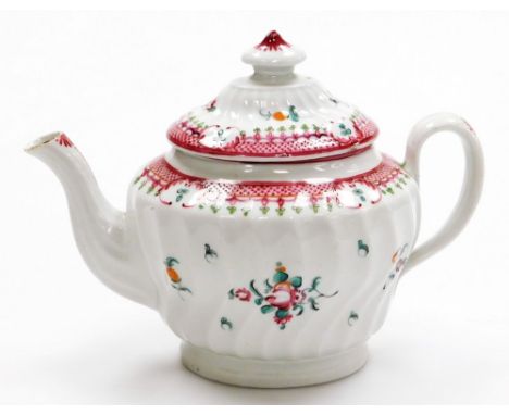 An early 19thC Newhall oval porcelain teapot, pattern 273, with sprays of flowers within puce scale borders, circa 1790-1805,