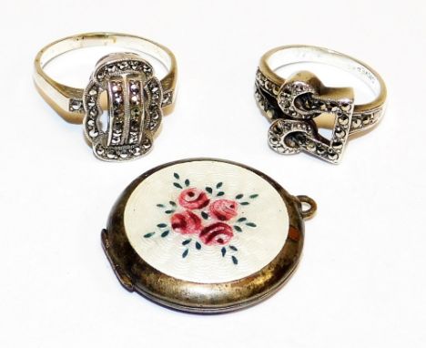 A group of silver jewellery, to include two silver and marcasite bow dress rings, and a silver and enamel set locket, with wh