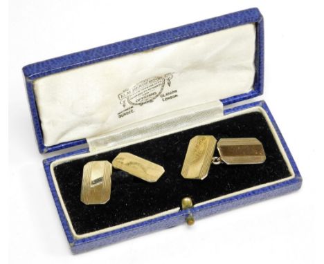 A pair of gold plated gentleman's cufflinks, each with rectangular panel with striped detailing and central chain link, in a 