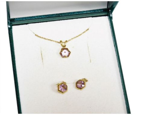 A 9ct gold amethyst set necklace and earring set, the hexagonal amethyst pendant with matching earrings, on a fine 9ct gold c