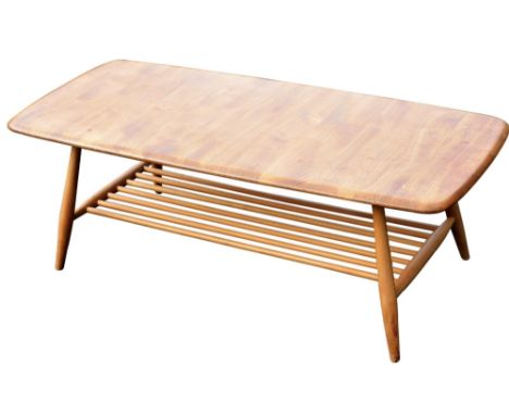 An Ercol light elm coffee table, of rectangular form with a slatted under tier, on tapering legs, 40cm high, the top 100cm x 