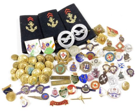 A group of various enamel badges and military buttons, naval shoulder badges, British Isles and Ireland enamel badges, Britis