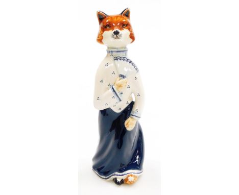 A Rye pottery fox figure, of a female fox in dark blue flowing dress signed LB, 23cm high. We have specific instructions form