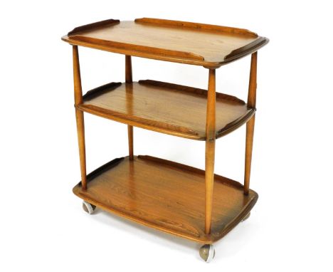 An Ercol elm three tier trolley, with a galleried edge, on castors, 78cm high, 70cm wide, 45cm deep.