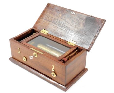A musical box, with a brass cylinder and steel comb, in later associated hardwood case (AF), 34cm wide. 