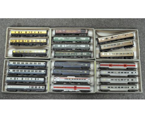 Over twenty 00 gauge train carriages, including a Triang Trans-Continental baggage and carriage car, a Hornby LMS Royal Mail 
