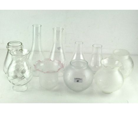 A selection of glass lamp shades, including frosted and clear glass examples, funnels from oil lamps and other pieces, 26cm h