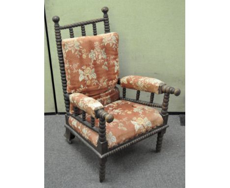 A Victorian bobbin turned arnchair, with loose back cushion and upholstered arms and seat, height 105cm
