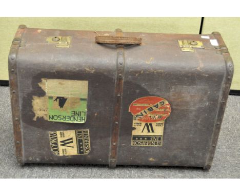 A vintage brown mid 20th century travelling steamer trunk, applied with travelling labels , 25 cm x 69 cm x 45 cm