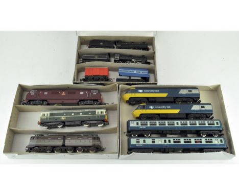 A collection of Lima 00 gauge locomotives, including the Intercity 125, together with coaches, Airfix locomotive and trailer,
