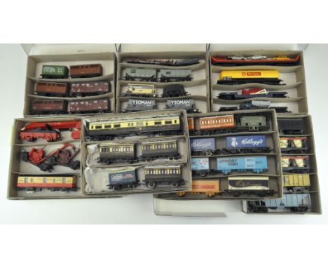A large quantity of 00 gauge freight stock, including some by Lima, Hornby and Triang, comprising car transporters, oil tanke