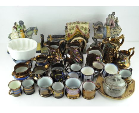 A large quantity of lustre ware ceramics, including pouring jugs, beakers and more, together with a jelly mould, continental 