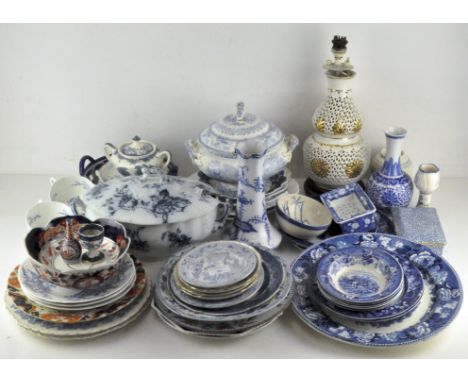 A large collection of blue and white ceramics, including: Staffordshire pottery tureens, dishes and plates, a Copeland Ironst