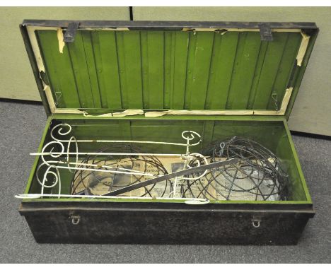 A large vintage metal storage trunk of rectangular form, 108cm wide, containing a few hanging garden baskets
