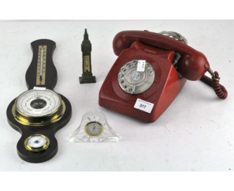 A vintage red telephone together with a barometer and further items