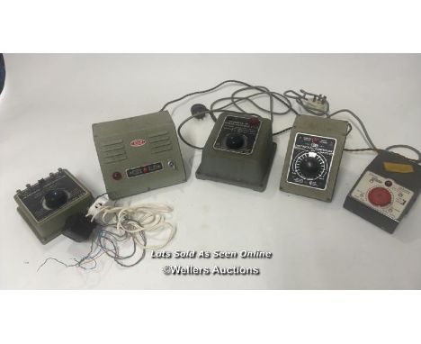A group of five model train power controllers including Tri-ang P5-5, Hammant &amp; Morgan and Meccano Marshal III, all untes