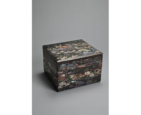 A JAPANESE Meiji period (1868-1912) BLACK LACQUER TWO TIER BOX. Of square section, inlaid with mother-of-pearl and shell with