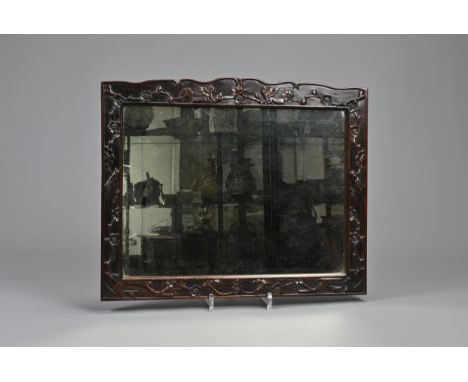 A CHINESE HARDWOOD FRAMED MIRROR, 19/20TH CENTURY. Of rectangular form carved in relief with birds and flowering prunus branc