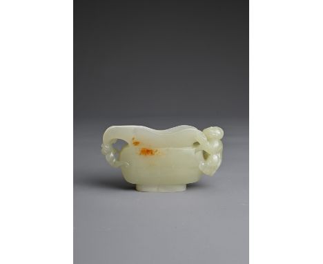 A CHINESE CARVED PALE CELADON JADE CUP. Pale celadon colour with russet patches, featuring a boy handle and a bat at the end 