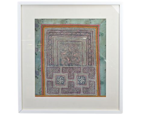 A FRAMED VINTAGE COTTON WOODBLOCK PRINT WITHIN CHINESE SILK BORDER. The cotton woodblock print probably Indian, printed with 