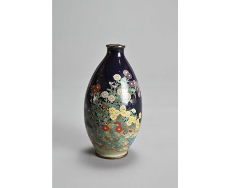 A JAPANESE CLOISONNE ENAMEL VASE, MEIJI PERIOD. Of ovoid form in a dark blue ground decorated with chrysanthemums. 12.5cm tal