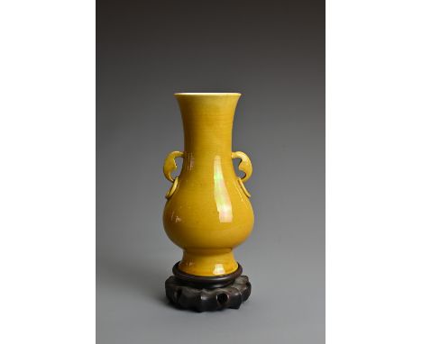 A CHINESE YELLOW GLAZED PORCELAIN VASE, LATE QING DYNASTY. Of baluster form covered in a with M formed ring handles and apocr