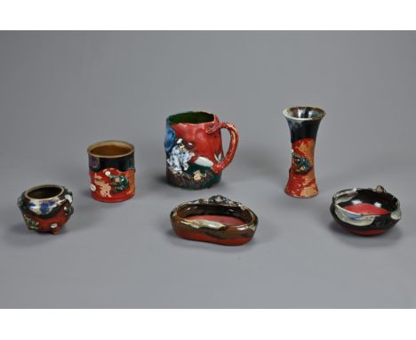 A COLLECTION OF EARLY 20TH CENTURY JAPANESE SUMIDA GAWA POTTERY. Comprising: a large mug with elephant moulded trunk handle a