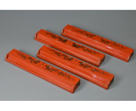 A SET OF CHINESE RED LACQUER MAHJONG RACKS, EARLY 20TH CENTURY. Each painted with two dragons and flaming pearl. The interior