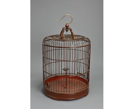 A LARGE 20TH CENTURY CHINESE RED PAINTED/LACQUERED WOOD BIRDCAGE. Of domed form, with central bobbin turned perch, with slidi