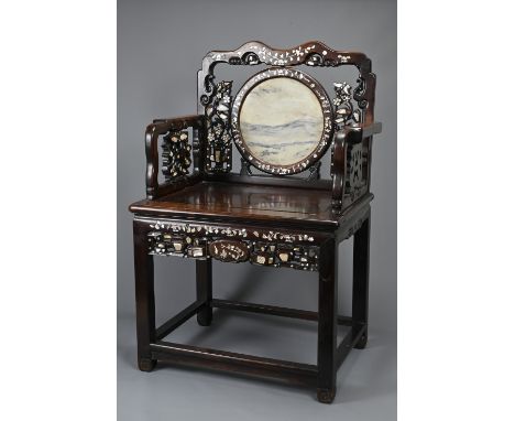 A CHINESE MOTHER-OF-PEARL INLAID AND MARBLE-INSET HARDWOOD ARMCHAIR, 19TH CENTURY. With shaped top rail inlaid with floral mo