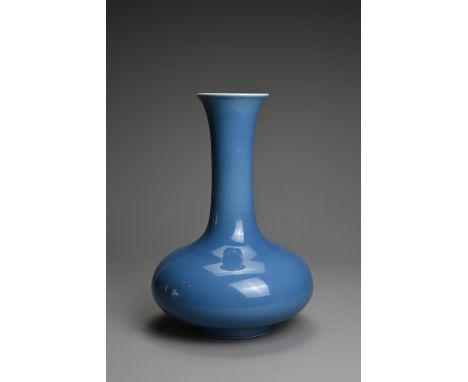 A CHINESE BLUE GLAZED PORCELAIN VASE, 20TH CENTURY. Squat bulbous body with tall tapered cylindrical neck leading into a slig