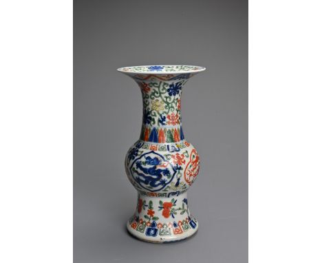 A CHINESE GU SHAPED WUCAI PORCELAIN VASE, 19/20TH CENTURY. Decorated with dragons, birds and floral scrolls between bands of 