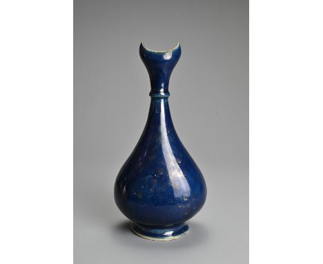 A RARE CHINESE BLUE GLAZED AND GILT DECORATED PORCELAIN VASE, 18TH CENTURY. Pear shaped bottle on splayed foot with an open c