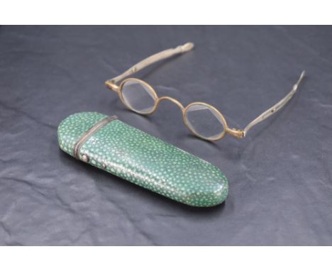 A pair of 19th century adjustable white metal 'Pebbles' spectacles, marked 'Pebbles' and bearing pseudo hallmarks to each arm