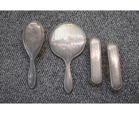 A four piece silver dressing table set having engine turned stripe decoration and bearing initial 'S', Birmingham 1923/24, Ad