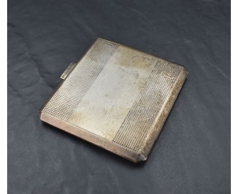A George V silver cigarette case, of hinged and canted square form with engine-turned decoration, marks for Birmingham 1945, 