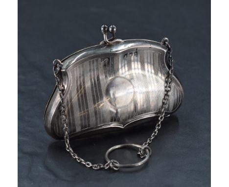 A George V silver purse, of shaped form with engine-turned decoration and sectioned leather interior, marks for Birmingham 19