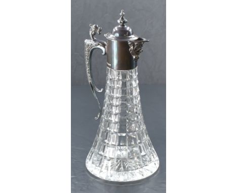 An Elizabeth II silver mounted cut-crystal claret jug, having hinged, domed and finial topped cover over the Baccus mask moul