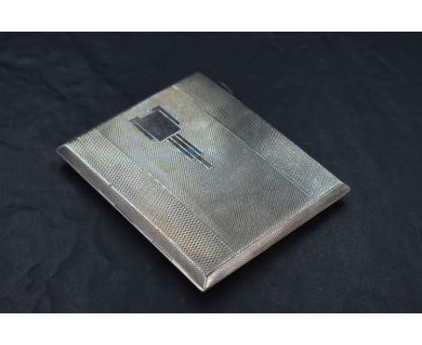 A 1930's Art Deco silver cigarette case, of hinged rectangular form engine-turned throughout and with Art Deco motifs, the gi