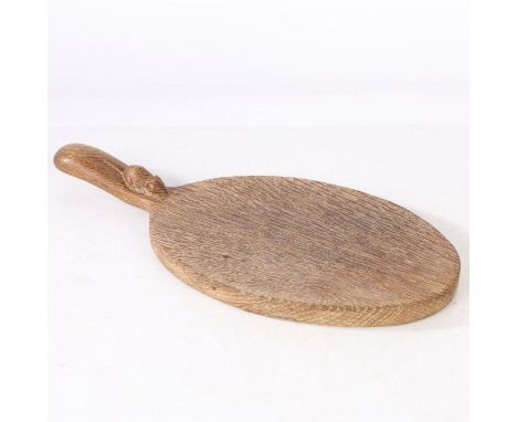 A Robert "Mouseman" Thompson chopping board, the oval board with a handle set with a mouse, 38cm long&nbsp;