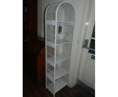 A white painted wicker conservatory shelf unit.