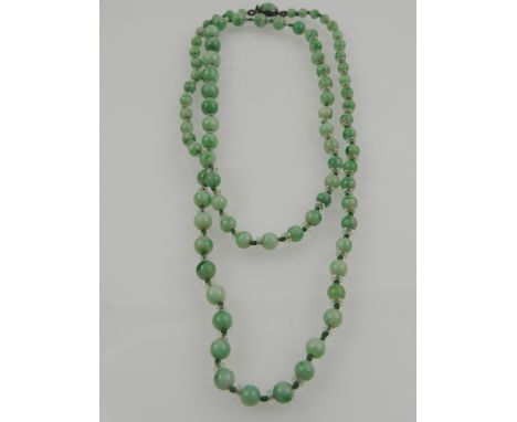 A green jade necklace, of graduated beads.