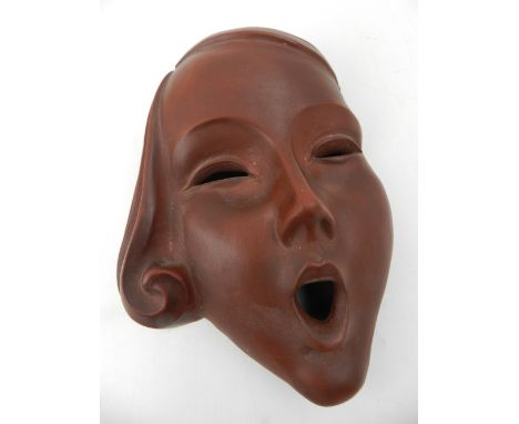 An Art Deco ceramic wall mask of an elegant lady. H: 16cm
