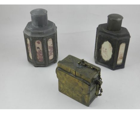 An early 20th century Chinese octagonal metal tea caddy the facets set with decorative glass panels showing figures, H. 18cm,