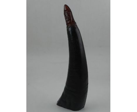 A 20th century Chinese horn, with carved Guanyin face finial, signed with character marks to verso. H. 25cm