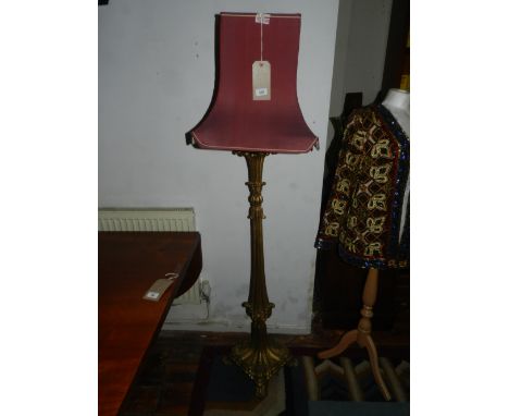 A gilt floor lamp, the square tapering lamp with foliate scrolls, H. 162cm.