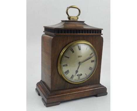 A 20th century Smiths electric mantel clock, the Georgian style walnut case with chamfer-top and brass swing handle, the dial