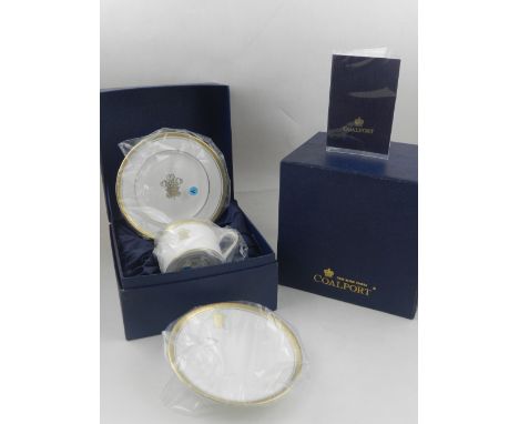 A pair of Coalport royal commemorative cups, saucers and side plates, the gilt decoration including Prince of Wales feathers,
