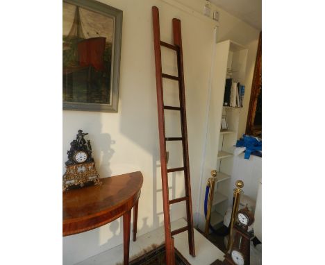 A Georgian style folding library ladder, of studded tan leather with ash treads, H 232cm.